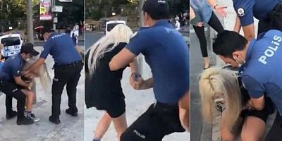 Maske takmadığı için bir kadını gözaltına alan polislere uzaklaştırma